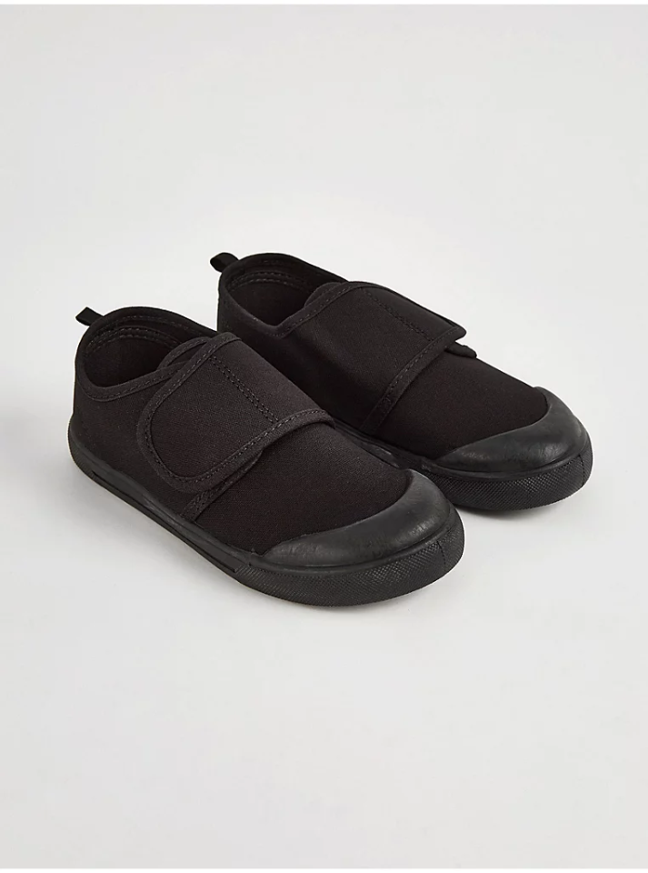 Pair of black children's velcro shoes.