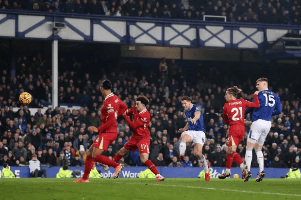 Soccer players vying for the ball during a match.