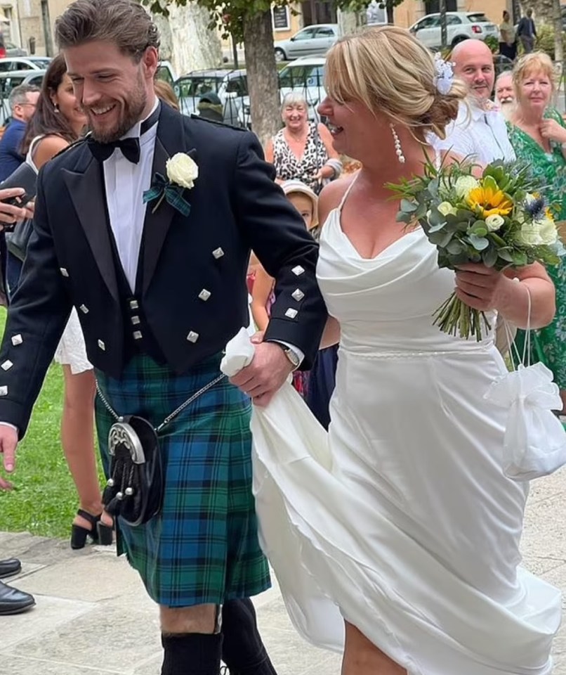 A bride and groom leaving their wedding ceremony.