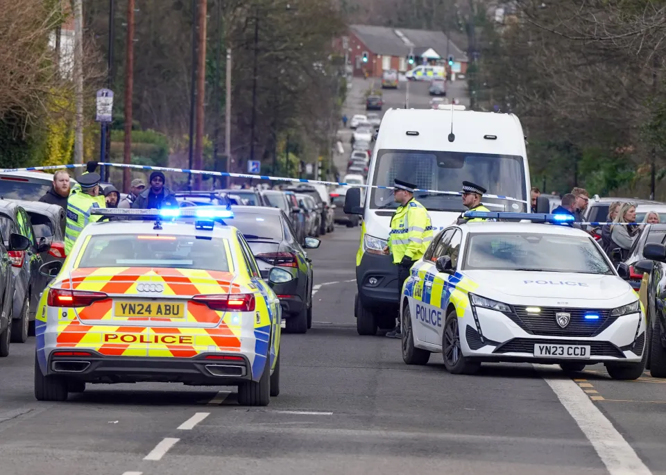 Police cars at a crime scene.