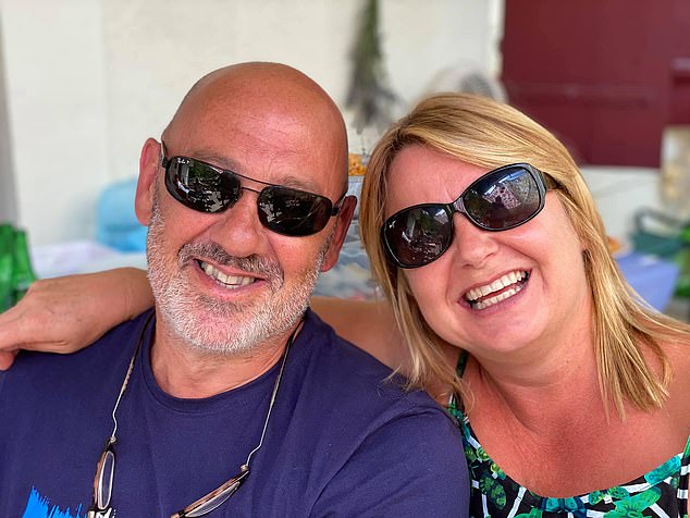 Smiling couple wearing sunglasses.