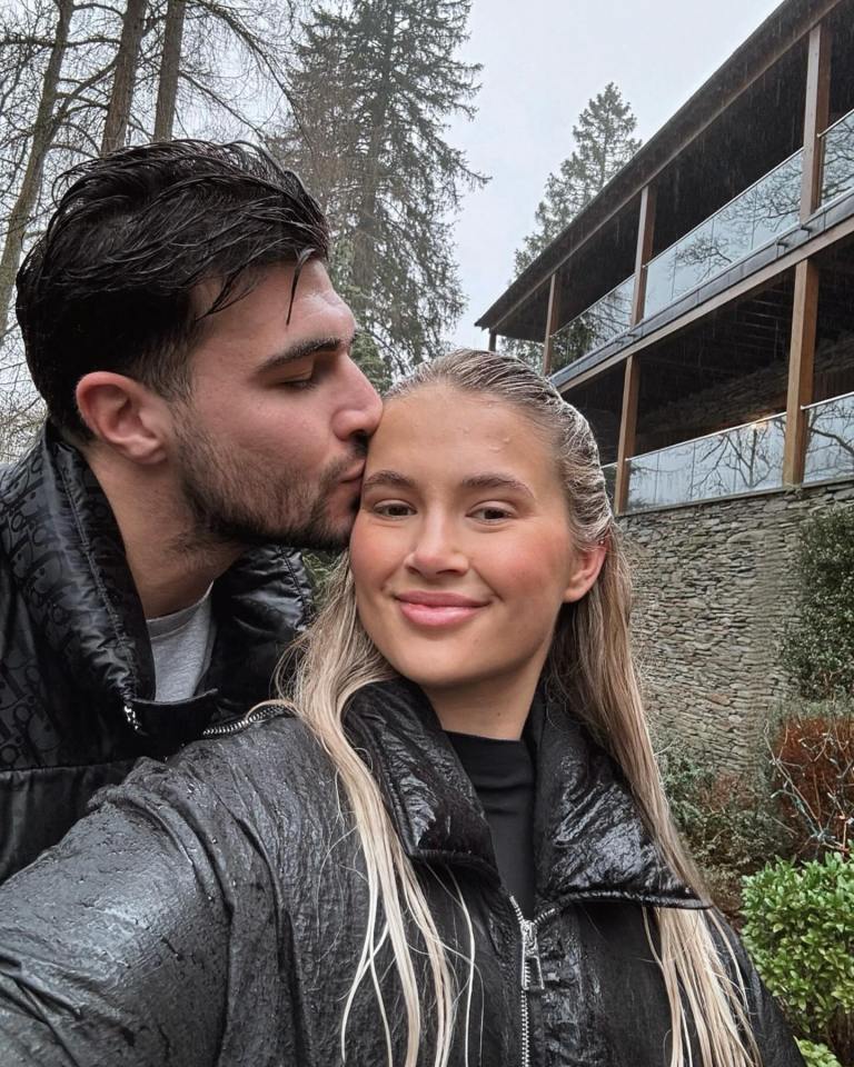 Molly Mae and Tommy Fury kissing during a Lake District staycation.