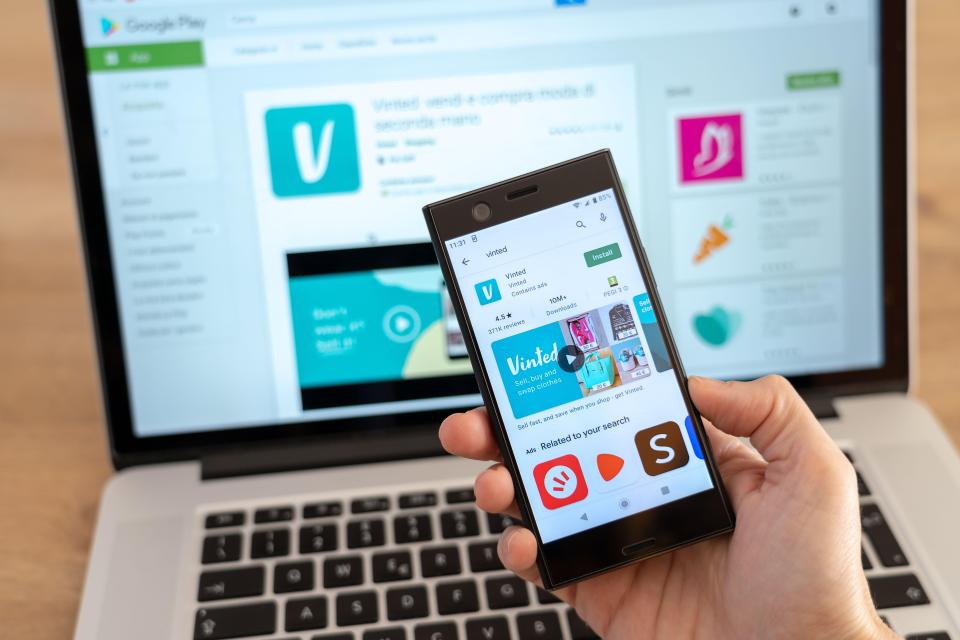 Smartphone displaying the Vinted app on the Google Play Store.