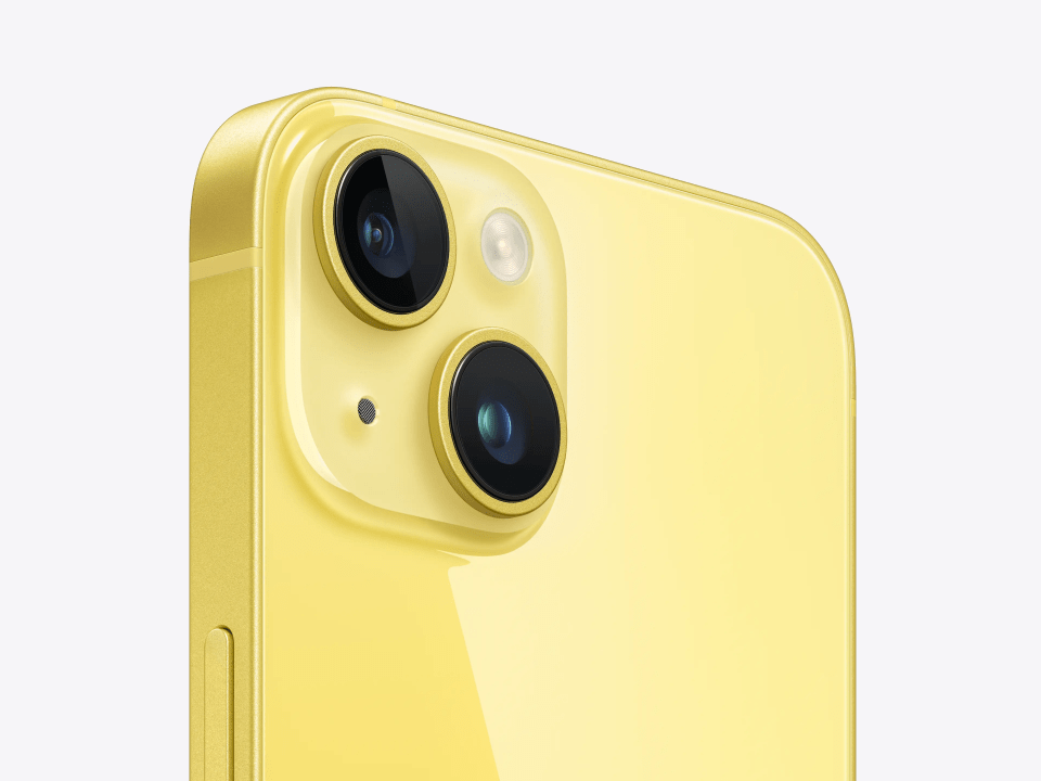 Close-up of the yellow iPhone 14 camera system.