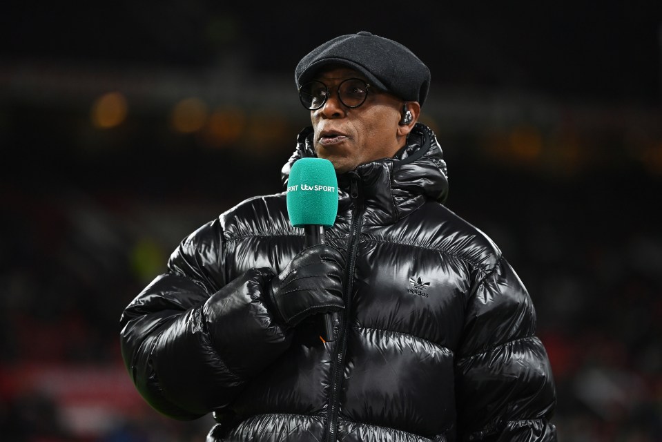 Ian Wright, ITV Sport pundit, holding a microphone.