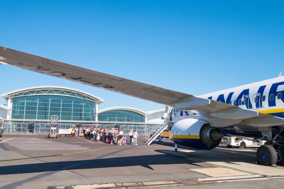 Passengers boarding a Ryanair plane at Bournemouth Airport.