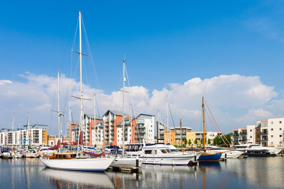 Boats and apartments at a marina.