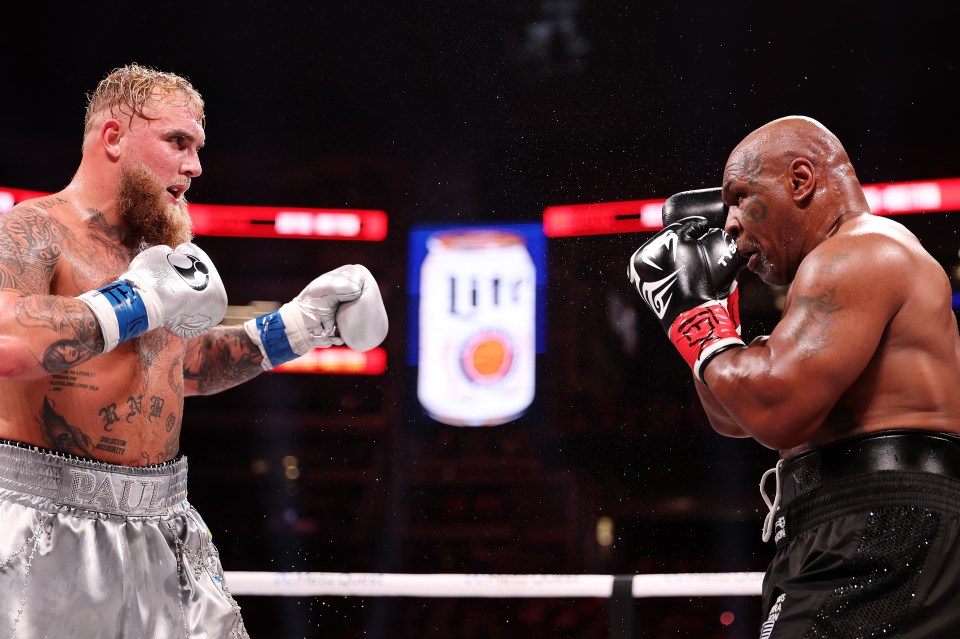 Jake Paul and Mike Tyson boxing.