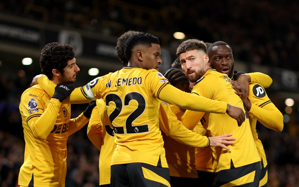 Wolverhampton Wanderers players celebrating a goal.