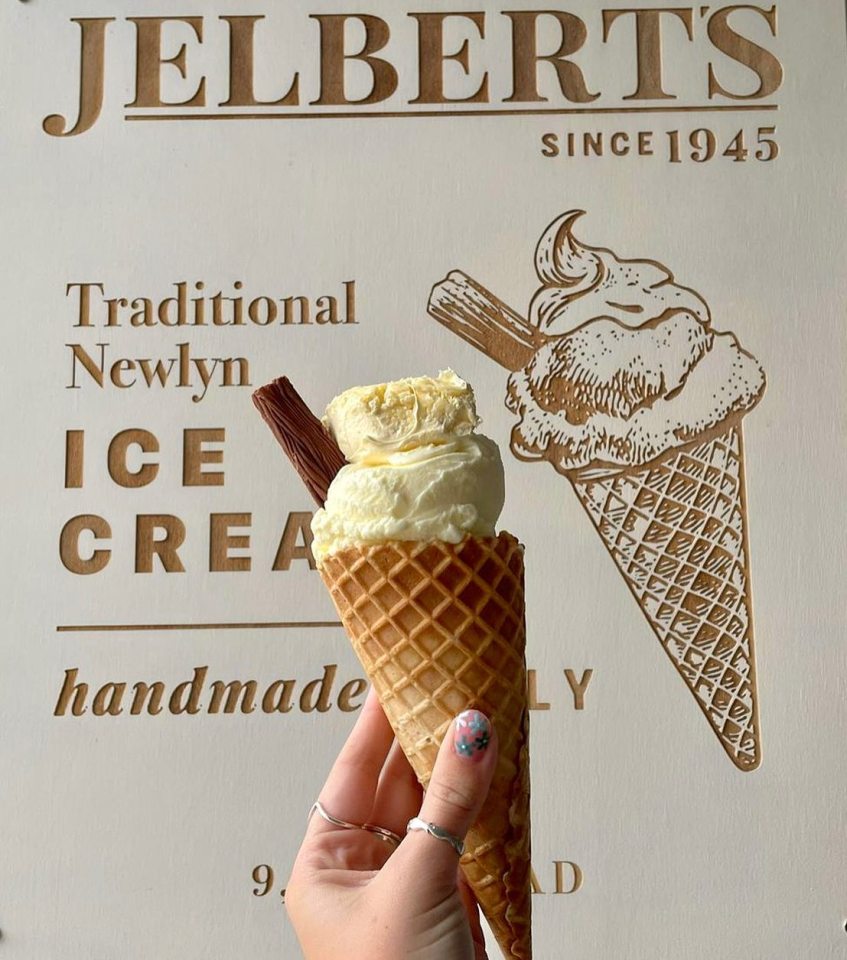 Ice cream cone in front of Jelberts Ice Cream shop sign.