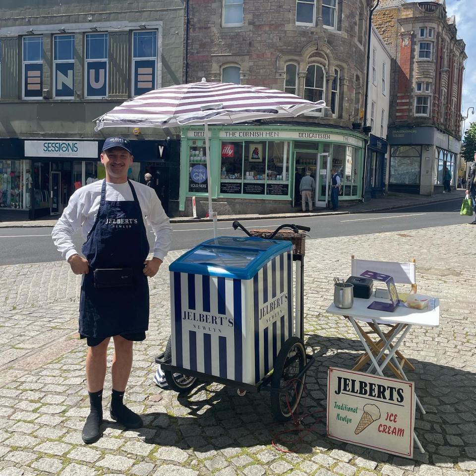 Man selling Jelbert's ice cream in Newlyn.