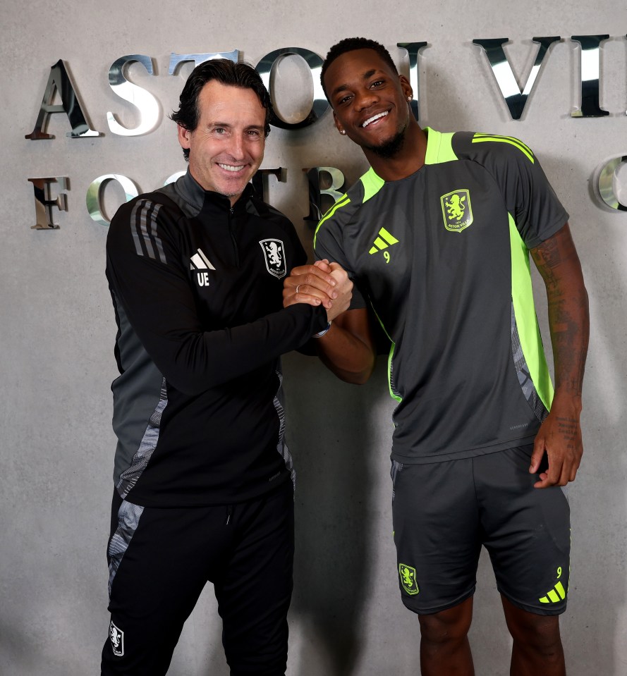 Jhon Duran shaking hands with Aston Villa manager Unai Emery.