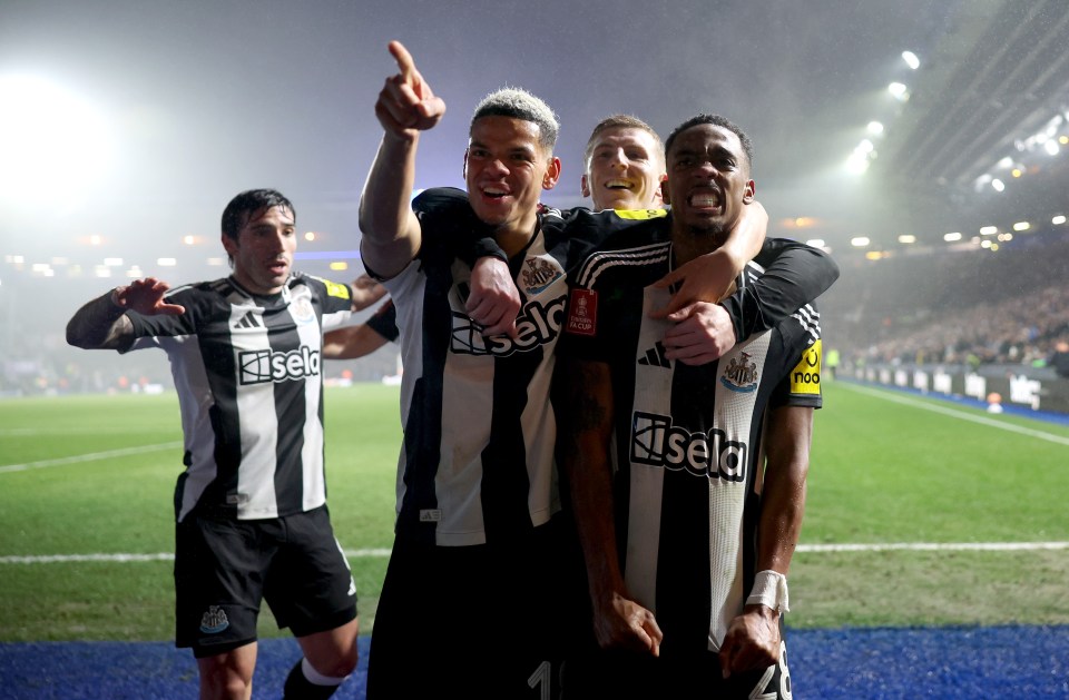 Newcastle United players celebrating a goal.