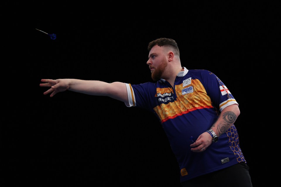 Josh Rock of Northern Ireland throwing a dart.