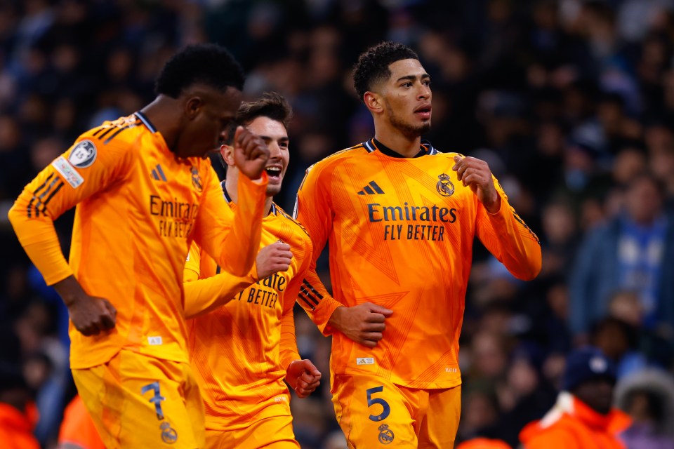 Real Madrid players celebrating a goal.