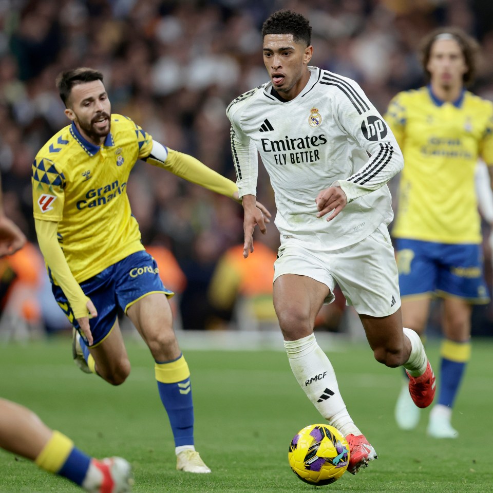 Jude Bellingham of Real Madrid dribbling the soccer ball during a match.