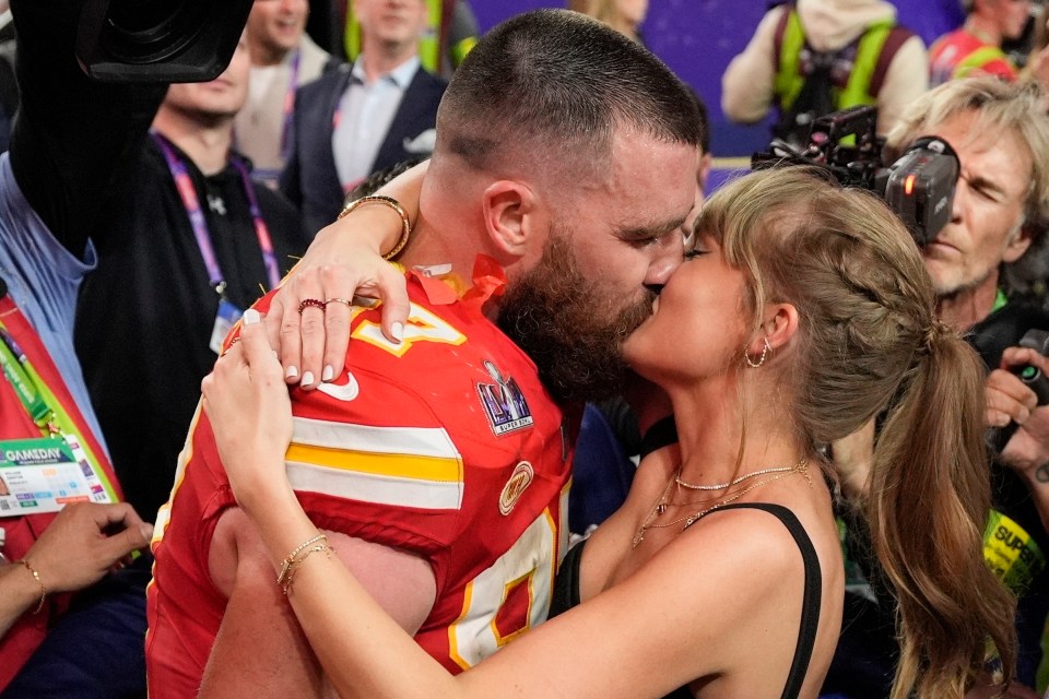 Travis Kelce kissing Taylor Swift after the Super Bowl.