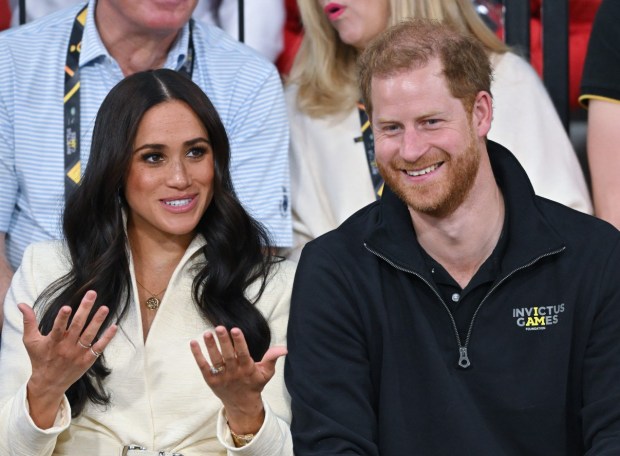 THE HAGUE, NETHERLANDS - APRIL 17: Prince Harry, Duke of Sussex and Meghan, Duchess of Sussex attend the sitting volleyball event during the Invictus Games at Zuiderpark on April 17, 2022 in The Hague, Netherlands. (Photo by Karwai Tang/WireImage)