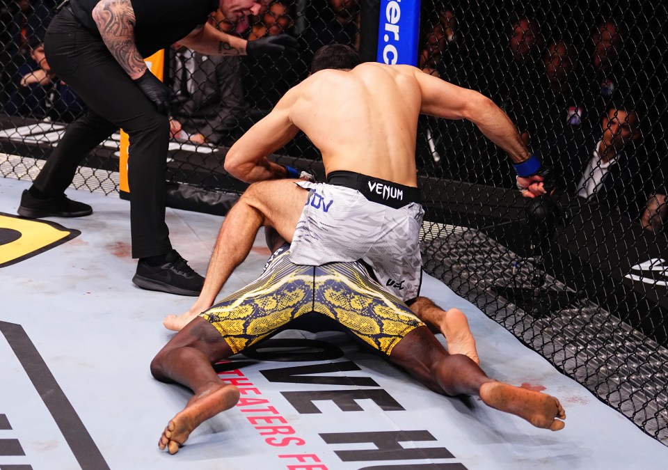 Nassourdine Imavov of Russia punching Israel Adesanya of Nigeria in a UFC middleweight fight.