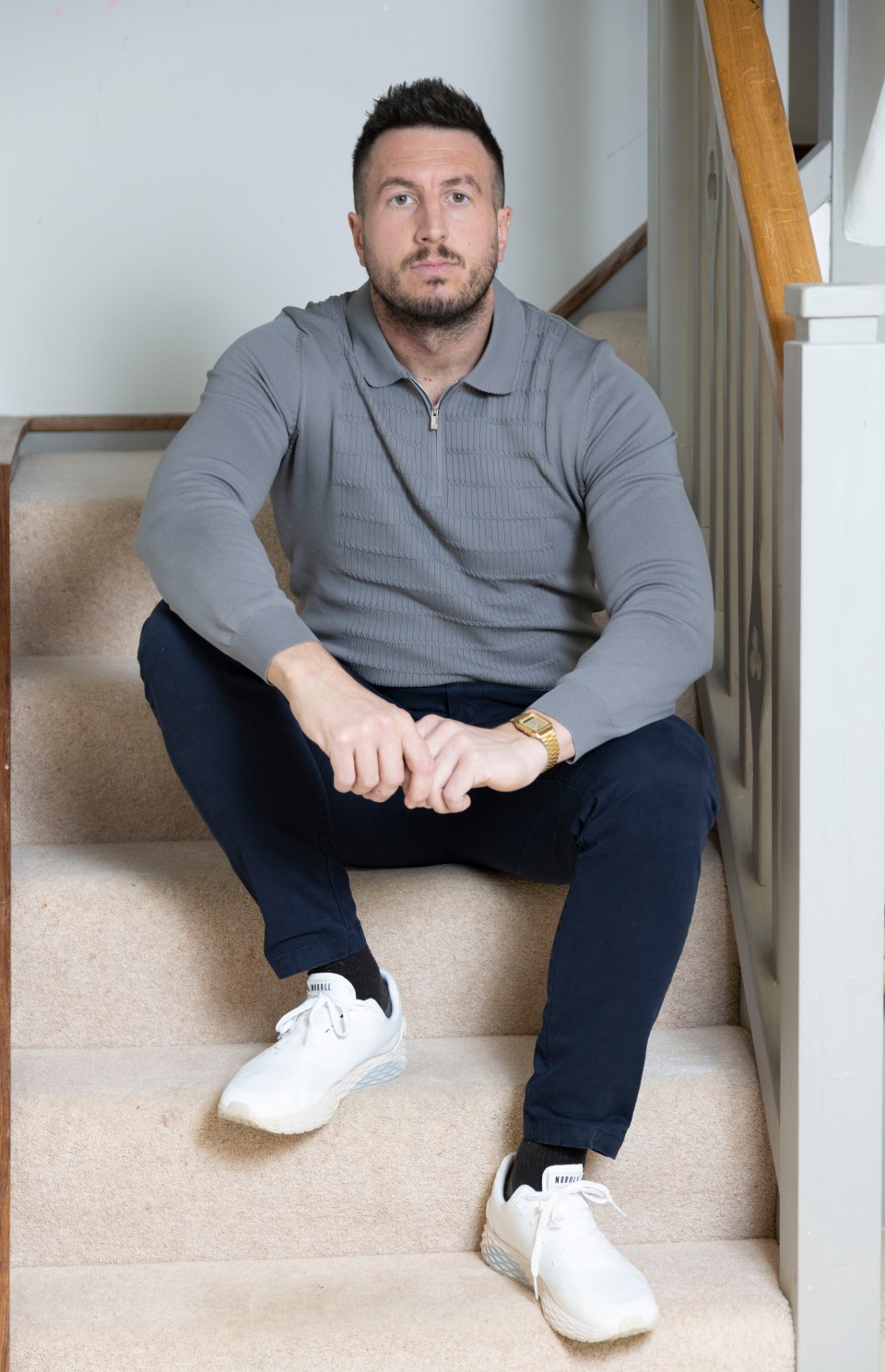 Man sitting on stairs.