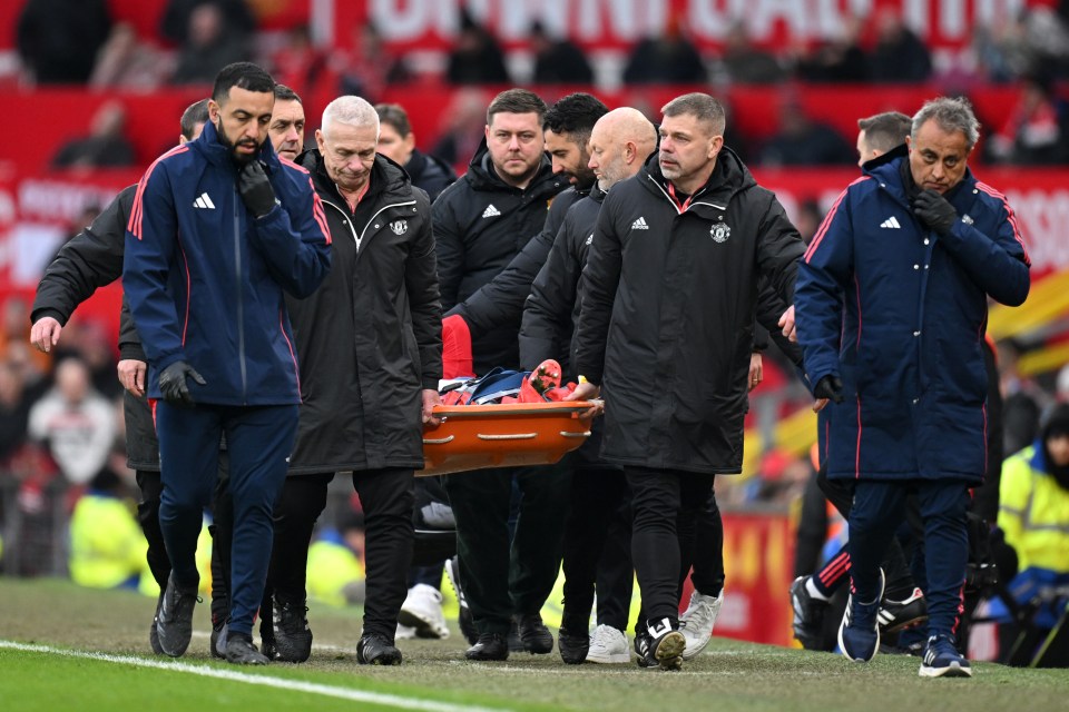 Lisandro Martinez of Manchester United being stretchered off the pitch.