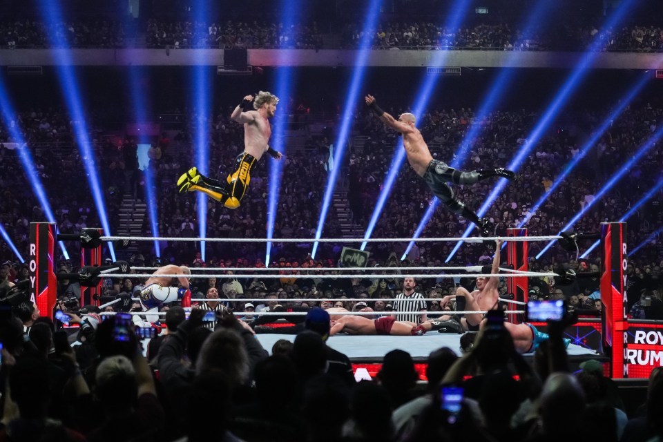 Logan Paul and Ricochet wrestling at the WWE Royal Rumble.