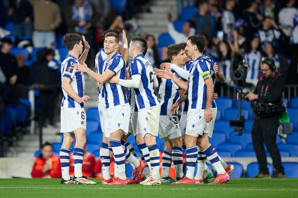 Real Sociedad players celebrating a goal.