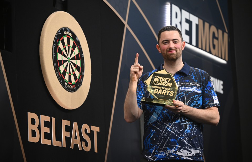 Luke Humphries celebrates winning the Premier League Darts.