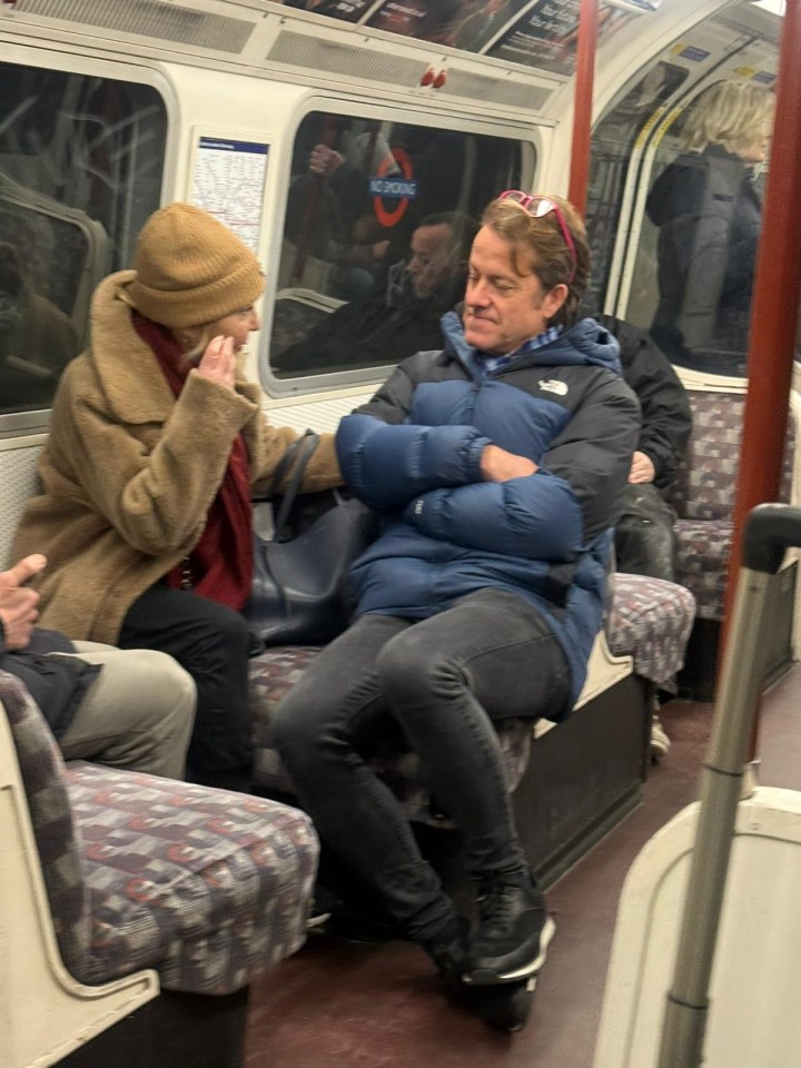 Singer Lulu on a London Underground train.