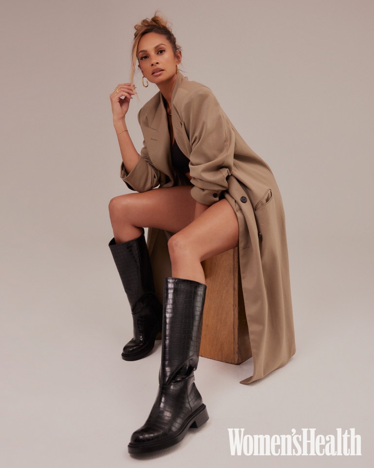 Alesha Dixon in a tan coat and black boots for Women's Health UK.