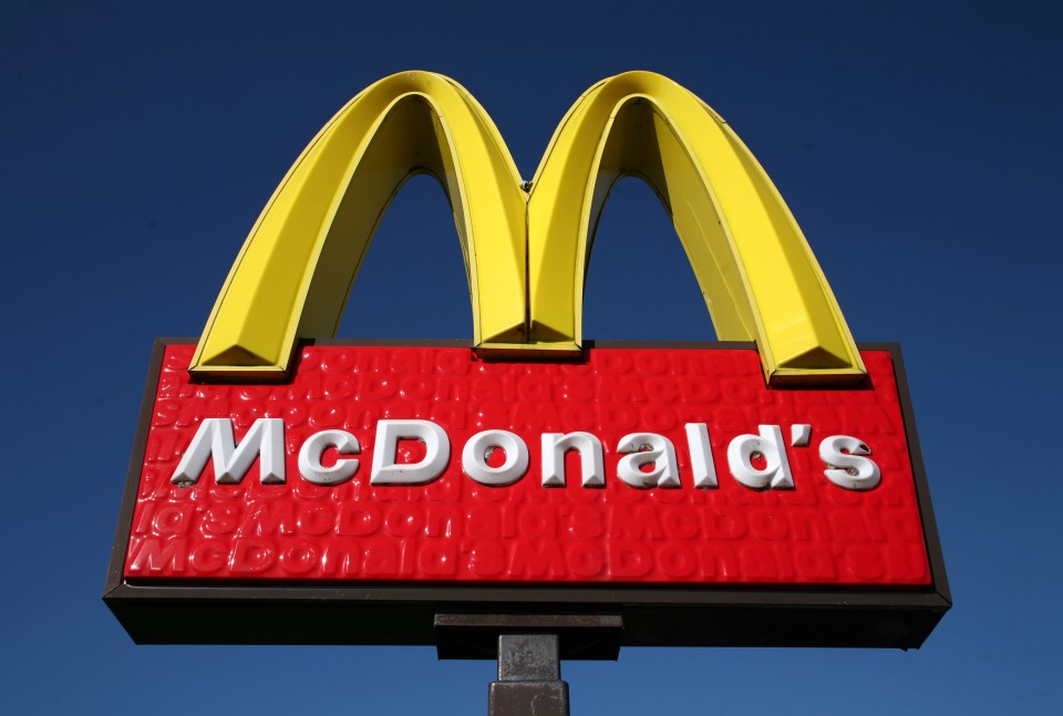 McDonald's sign against a blue sky.