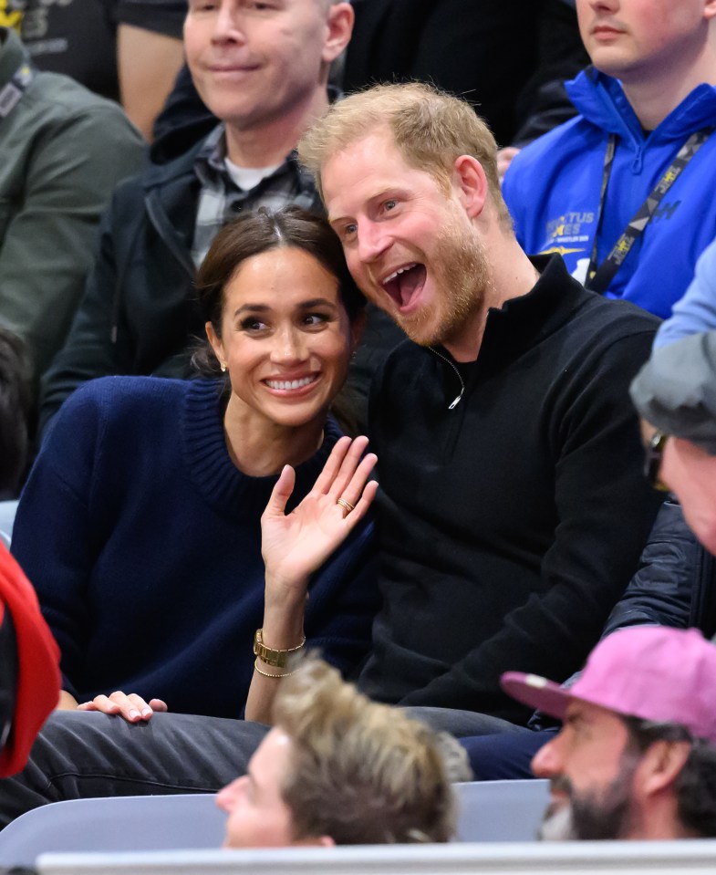 Meghan Markle and Prince Harry at a wheelchair basketball game.