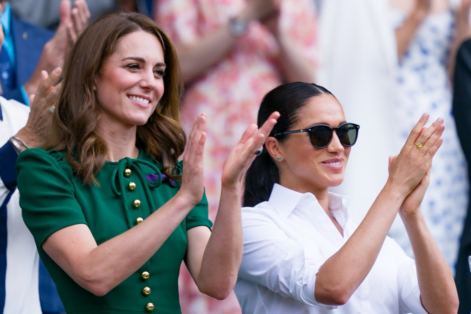 Catherine, Duchess of Cambridge, Meghan, Duchess of Sussex, and Pippa Middleton applauding at Wimbledon.