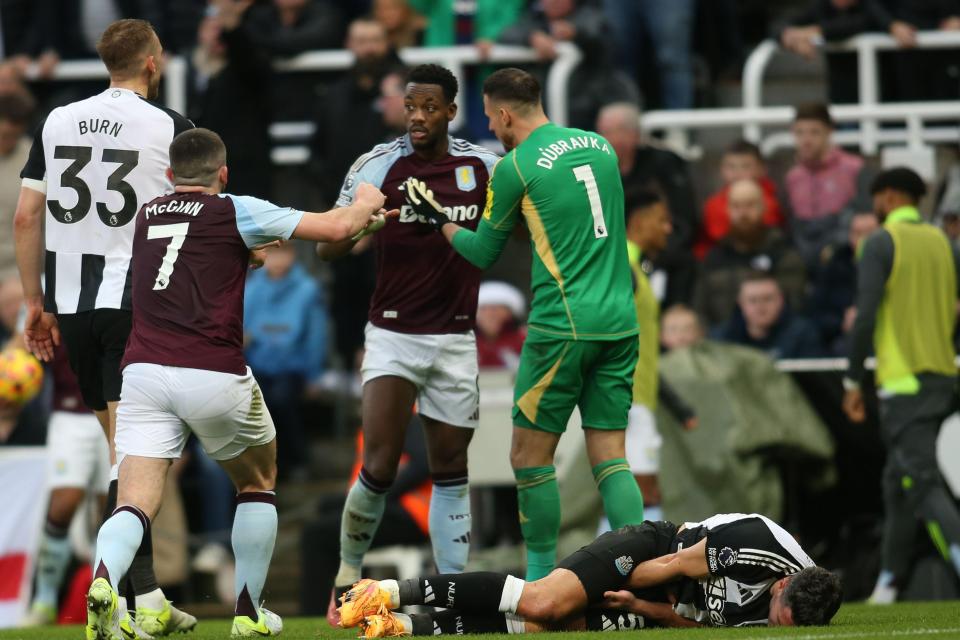 Newcastle United and Aston Villa players during a Premier League match.