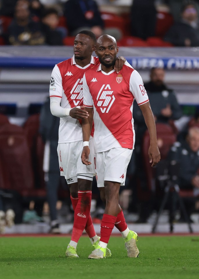 AS Monaco's Denis Zakaria embracing teammate Moatasem Al-Musrati after a red card.