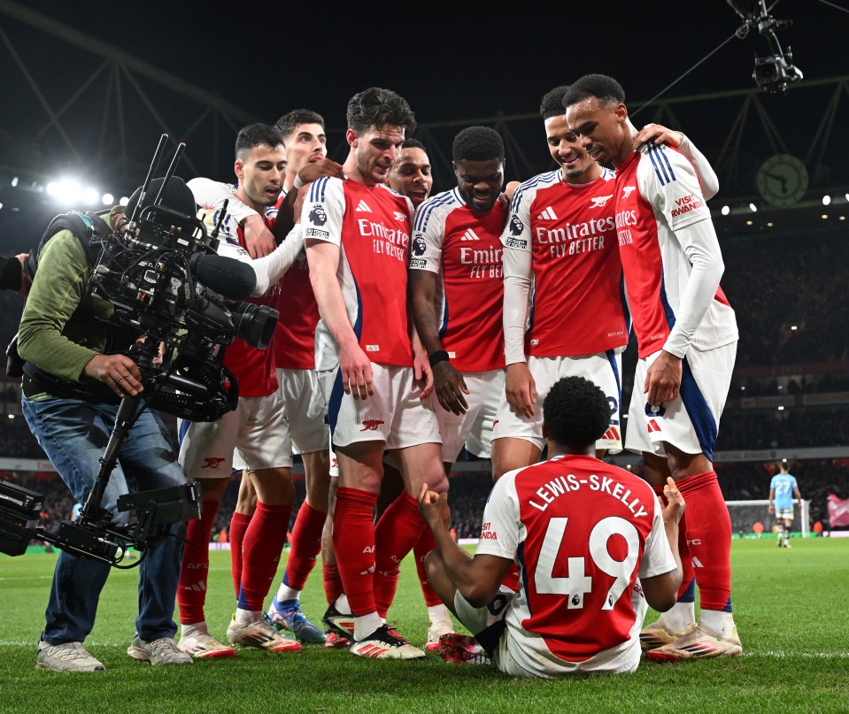 Arsenal players celebrating a goal.