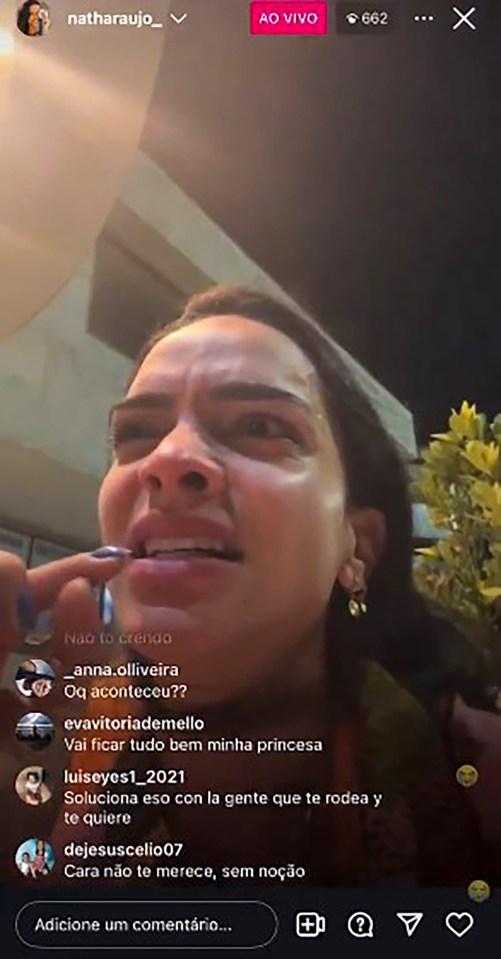 Screenshot of a woman crying on a live video, reacting to discovering her boyfriend was cheating.