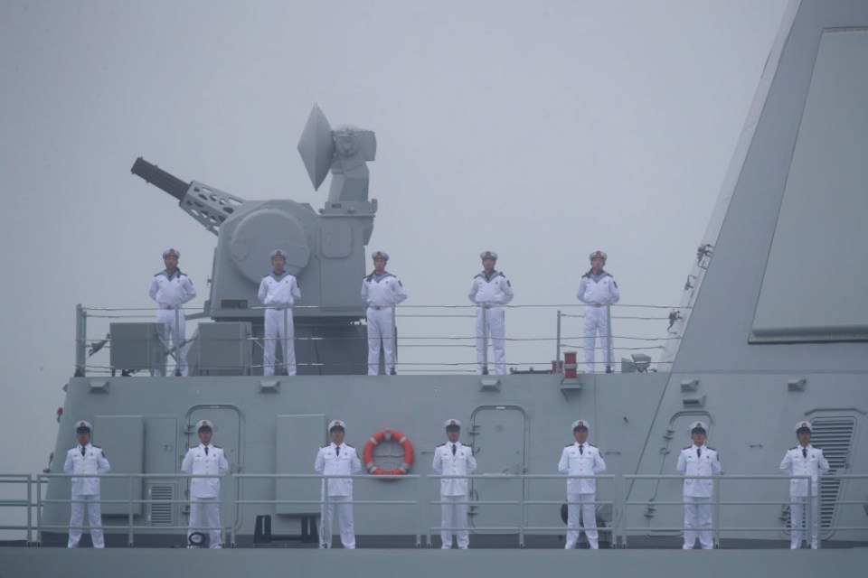 Sailors on the deck of a Chinese Type 055 guided-missile destroyer.