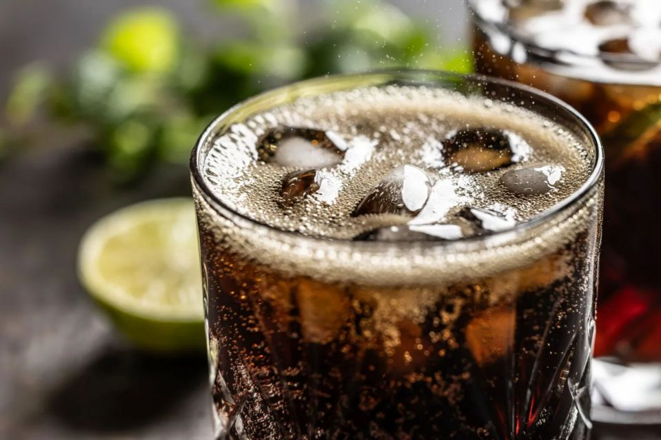 Close-up of a glass of cola with ice.