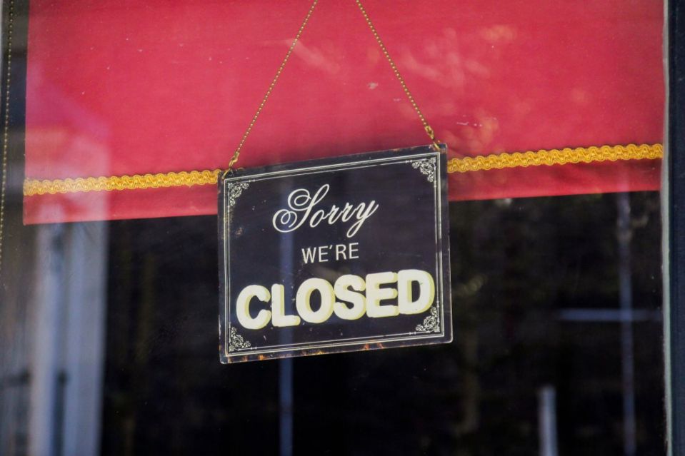 Closed sign in a shop window.