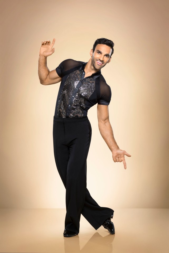 Davood Ghadami in a black dance outfit.