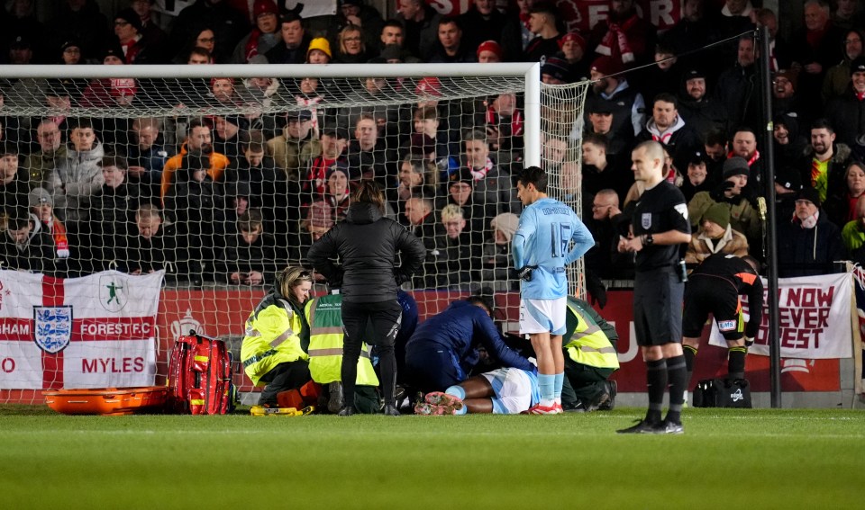 Soccer player receiving medical attention on the field.