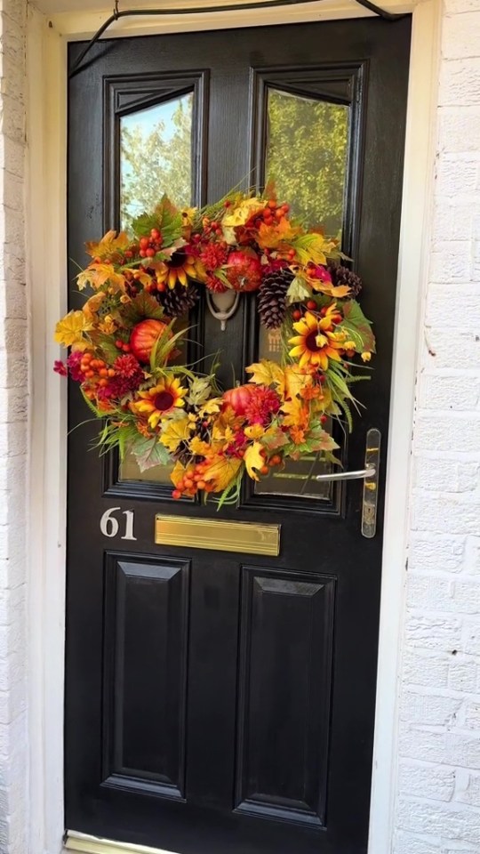 Autumnal wreath on black door.