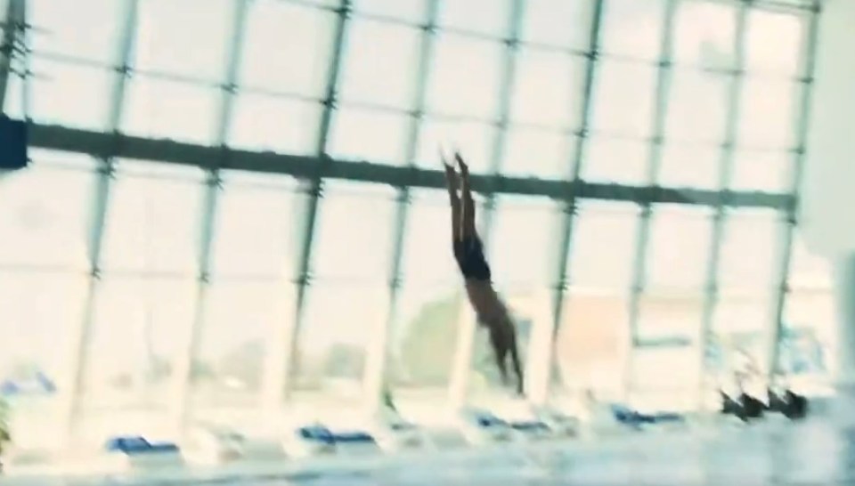 Man diving into a pool.