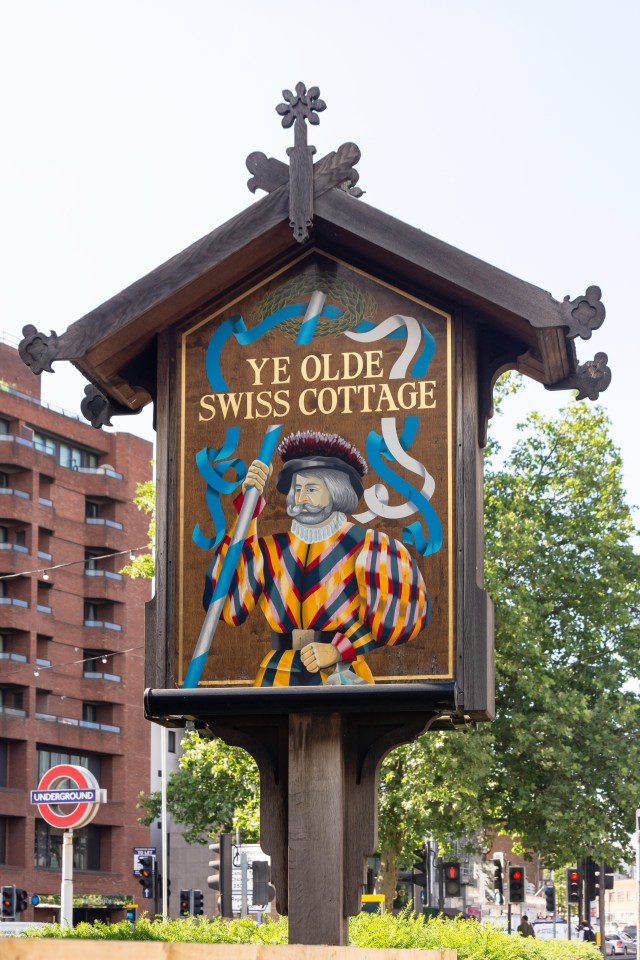 Pub sign for Ye Olde Swiss Cottage.