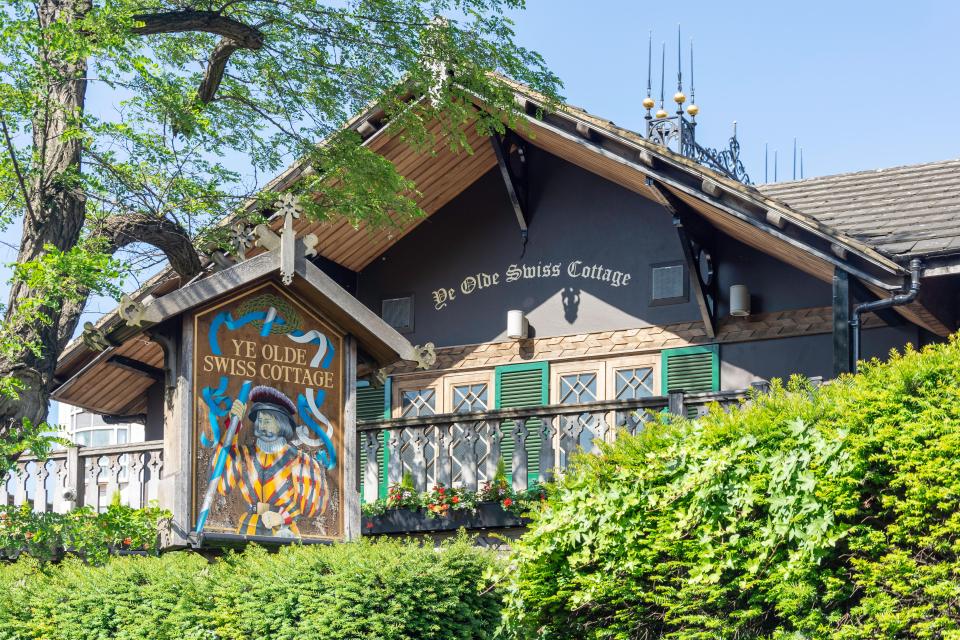 Ye Olde Swiss Cottage pub sign in London.