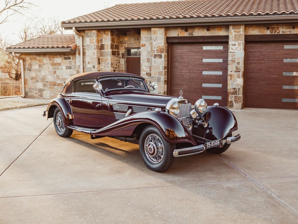 1937 Mercedes-Benz 540 K Cabriolet A in front of a house.