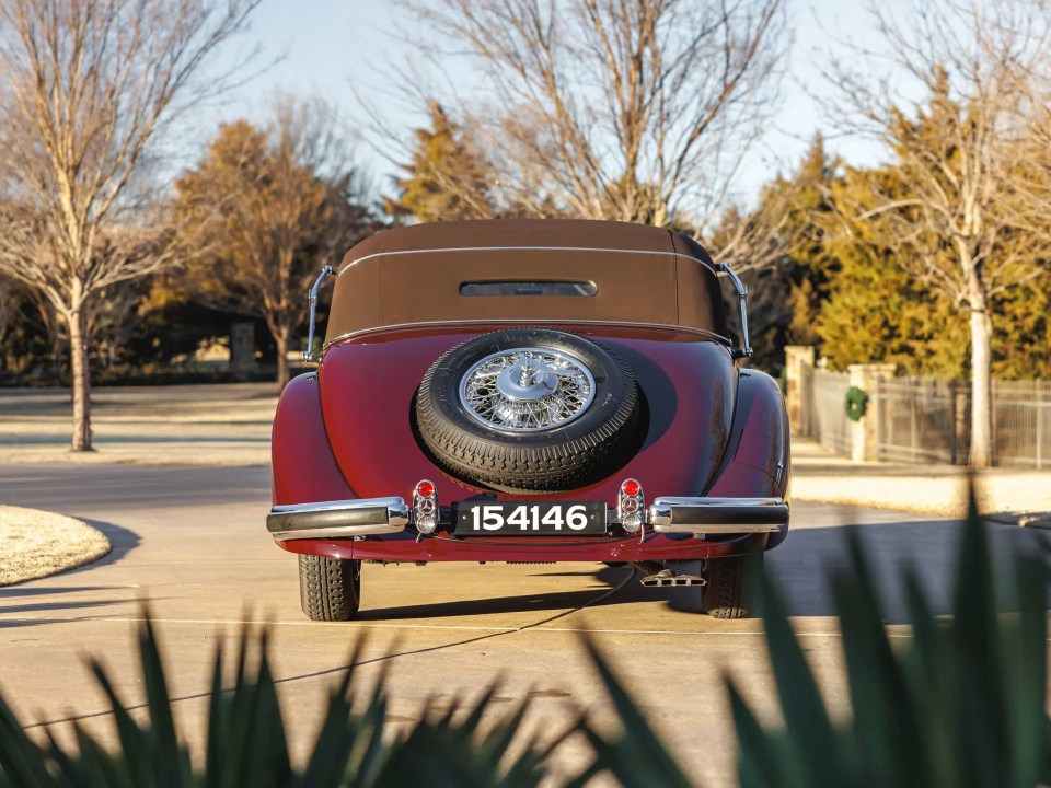 Rear view of a burgundy 1937 Mercedes-Benz 540 K Cabriolet A.