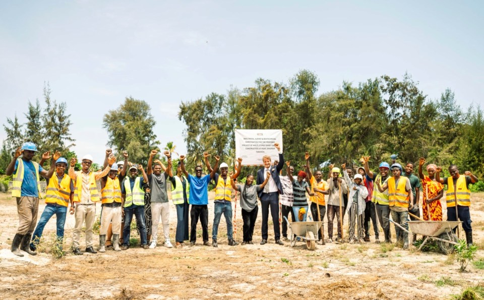 Ashby with the construction team after the successful project got the green light