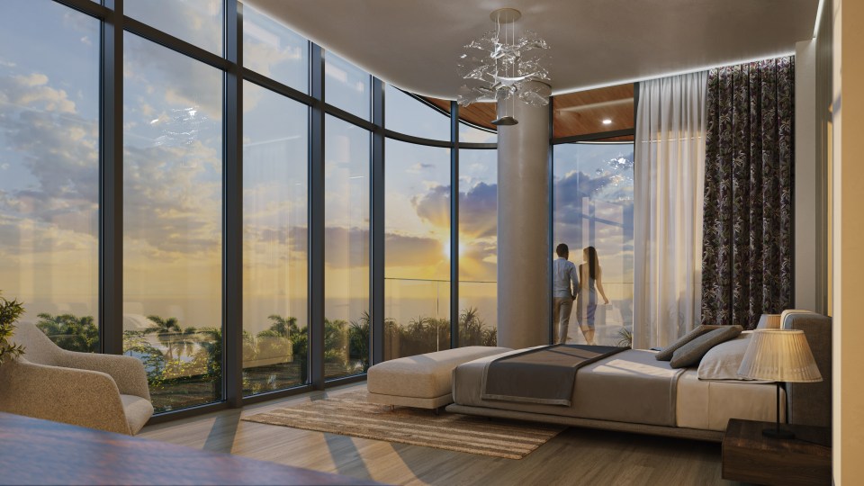 Illustration of a penthouse bedroom with floor-to-ceiling windows overlooking a sunset ocean view; a couple stands on a balcony.